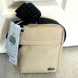 NWT Lacoste vertical camera bag, beige, unisex, adjustable crossbody strap